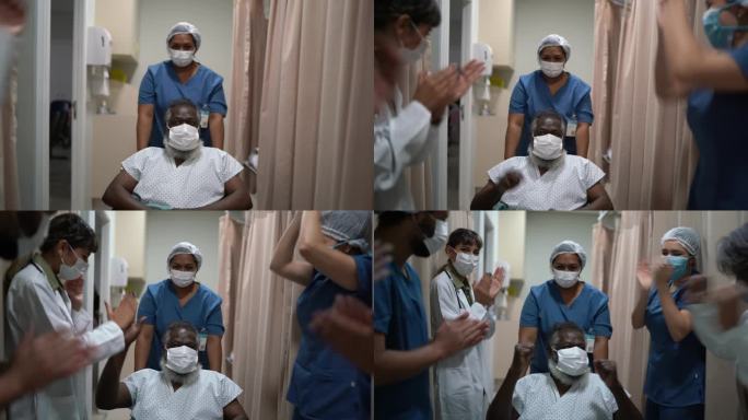医生和护士正在庆祝老人康复出院-戴着防护面罩