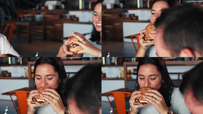 一组年轻朋友一起吃汉堡庆祝的4k视频片段