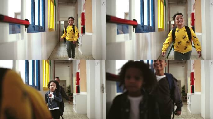 微笑着的孩子们匆匆穿过学校走廊