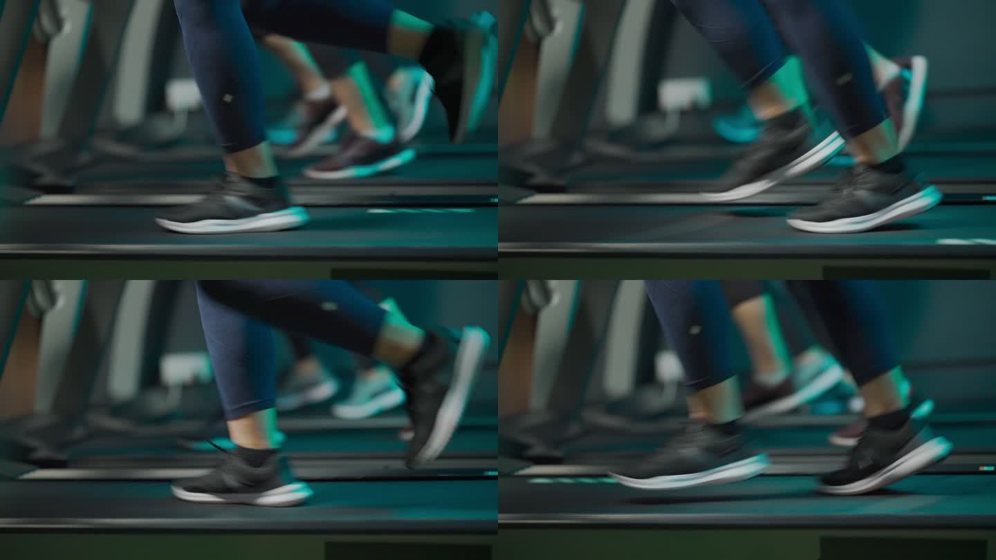 低角度侧视图：身体积极的女性，晚上和她的女性朋友一起在健身房跑步机上跑步，面对城市街灯