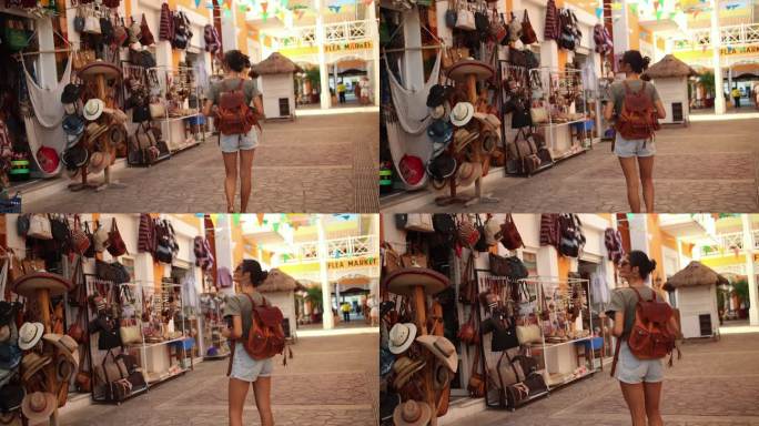 一个年轻的女人走在街上，在当地商店寻找报价