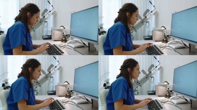 女护士在医务室的电脑上工作