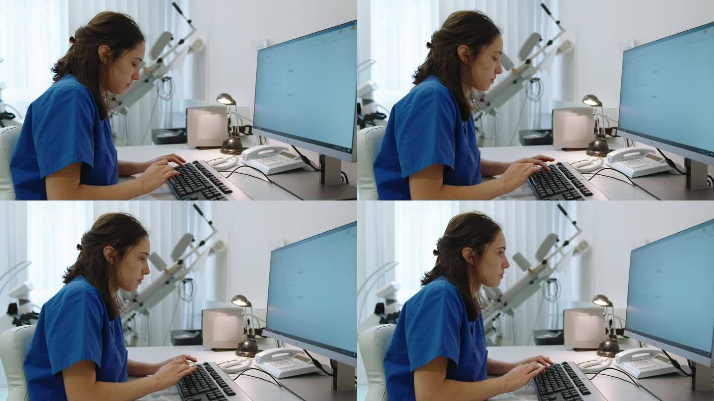 女护士在医务室的电脑上工作