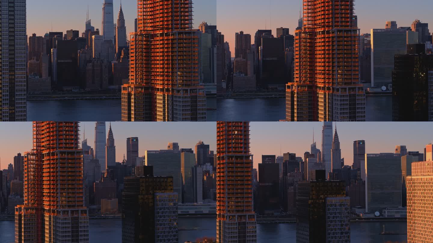纽约皇后区长岛市住宅滨水区鸟瞰图，后面部分可见曼哈顿中城的天际线。