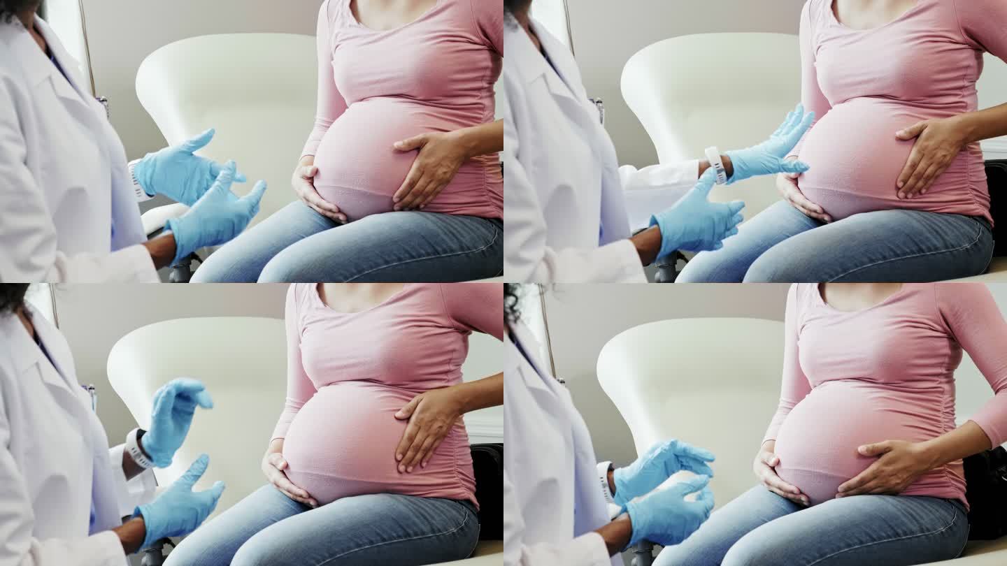 无法辨认的准妈妈在产前检查时与医生交谈