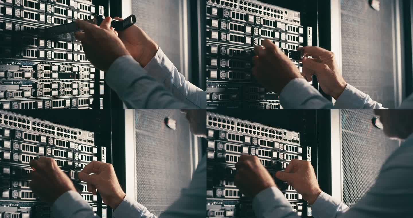 一个无法辨认的技术人员独自站在服务器室更换硬盘的4k视频片段