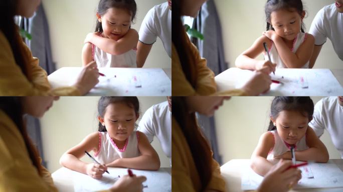 年轻的亚洲女孩在心理治疗课上画画。