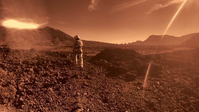 在火星上行走。一名女宇航员正在探索铁锈山脉。红色阳光和灰尘