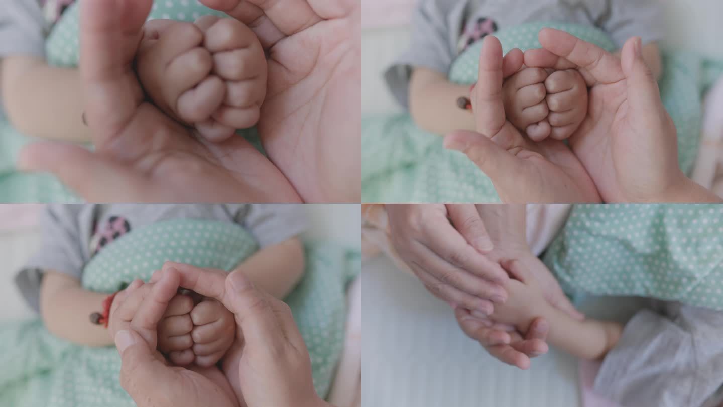 母亲呵护宝宝的双手