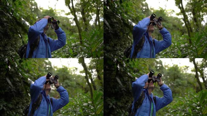 在森林里用双筒望远镜观察的年轻女子