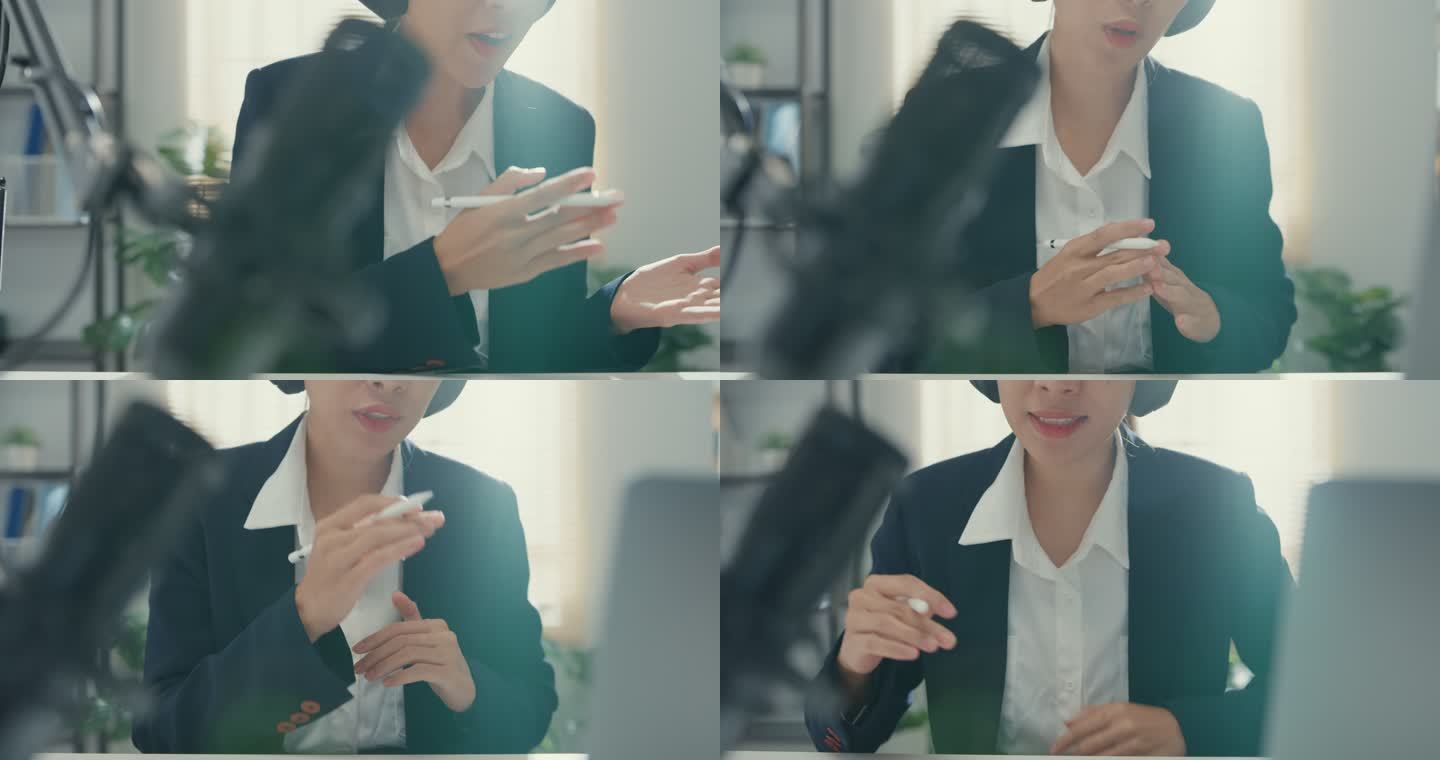这是一位年轻的亚洲女商人在工作室办公室的笔记本电脑上录制和播放播客的特写镜头。