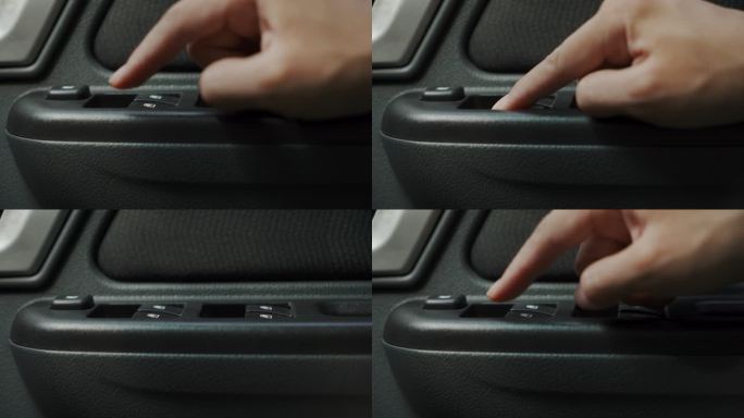 女人在车上按车窗按钮的手