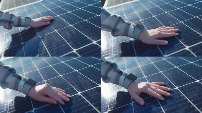工程师手触摸和移动太阳能电池板电源的特写镜头