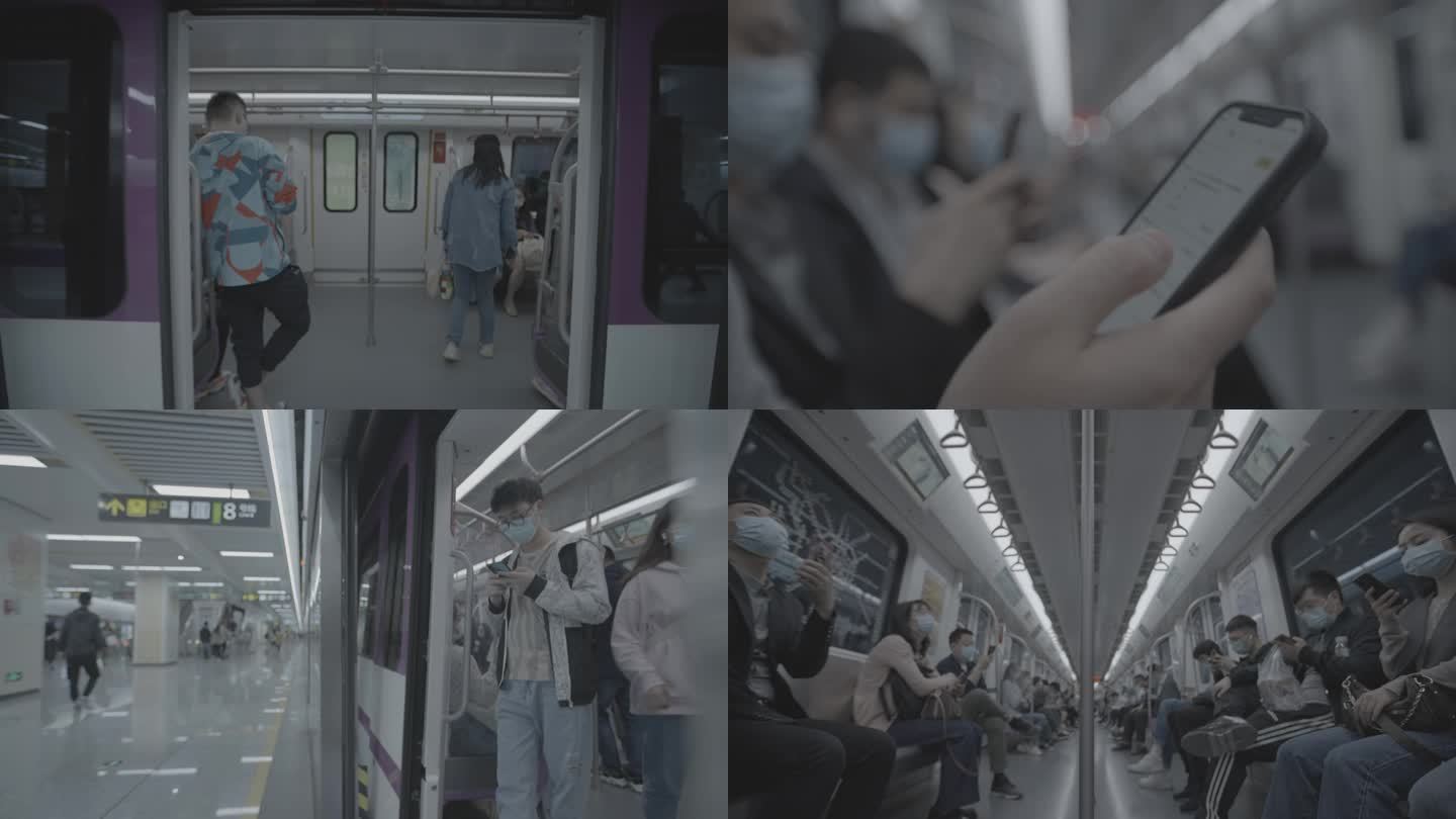 地铁乘客看手机