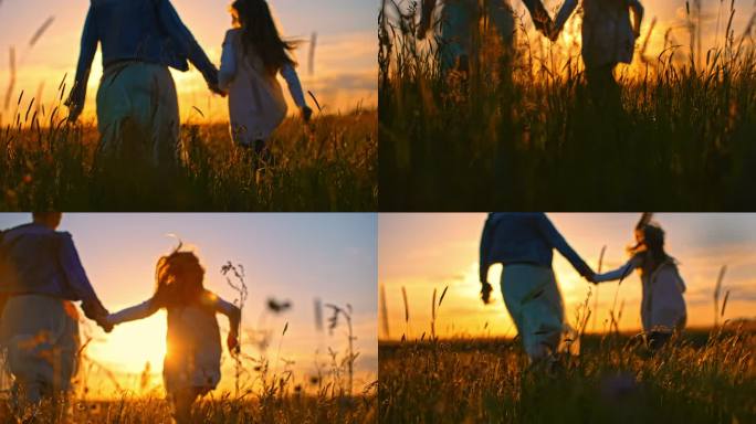 SLO-MO母亲和女儿手牵着手在日落时的草地上跑步