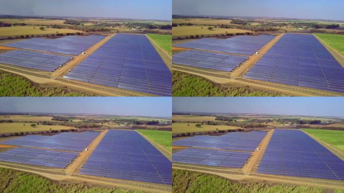 用于清洁能源发电的大面积上数百个太阳能模块或成排太阳能板的航拍图像。空中无人机的视角