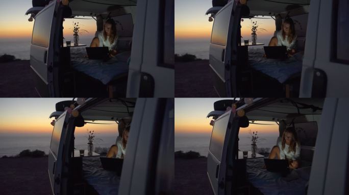 职业妇女。一个坐在面包车里的工作妇女在笔记本电脑上打字。