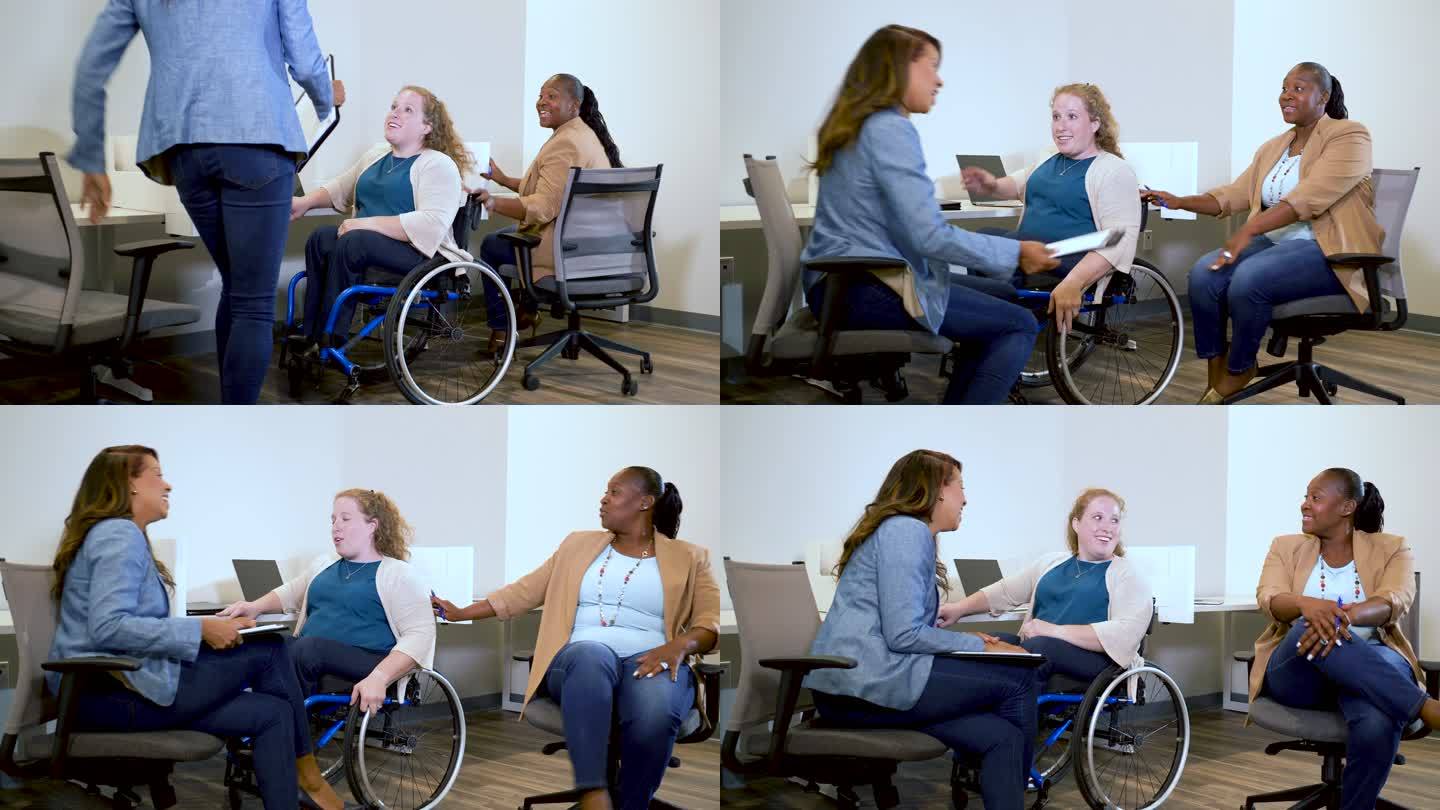 三位女商人在办公室见面，一位坐在轮椅上