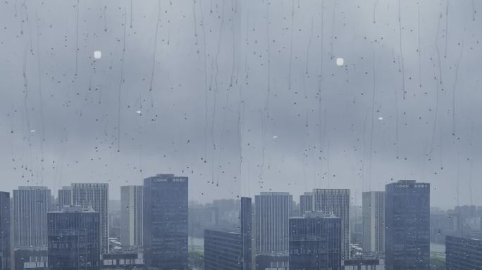 宁波东部新城雨天落地窗外雨滴落下