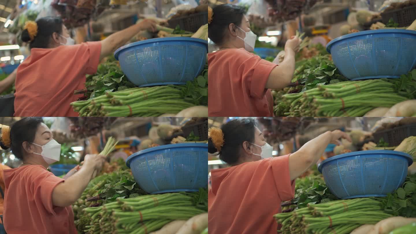 亚洲高级女性购物蔬菜。