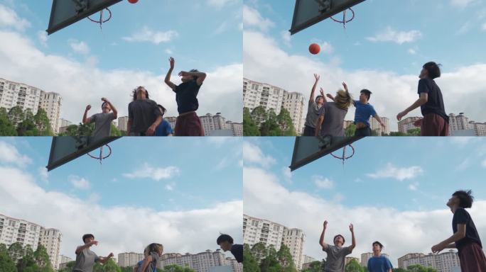 Z世代：亚洲中国青少年男孩挑战球员，在周末早晨与朋友一起打篮球，练习篮球比赛