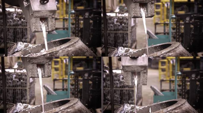 铝熔炼，操作员努力工作，将钢包中的熔融金属送入保温炉压铸机