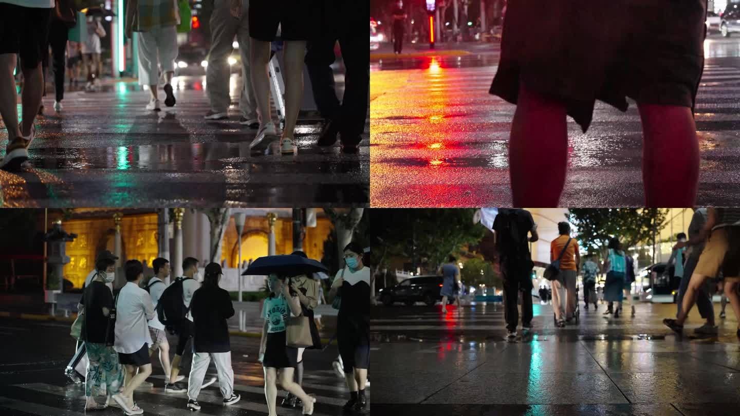 上海下雨夜晚路口的行人