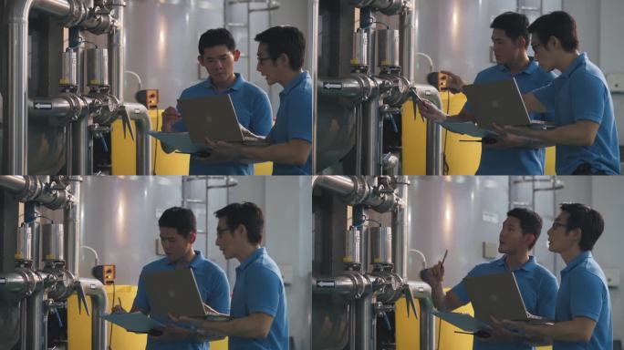 2名亚裔中国技术员，维护工程师，记录水箱中的压力计读数，瓶装水工厂的日常质量控制，在剪贴板上书写进度