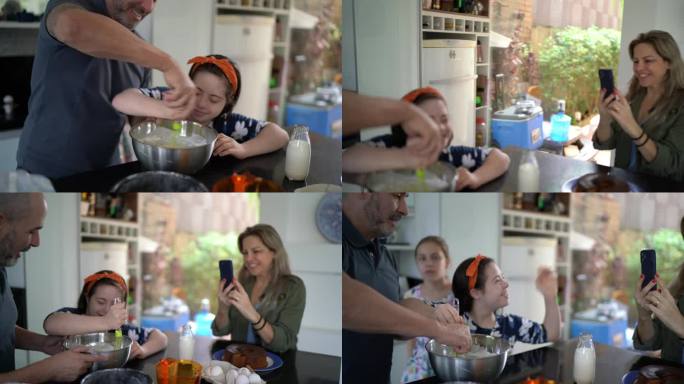 一家人一起做蛋糕，母亲在家拍摄——包括一个特殊需要的女孩