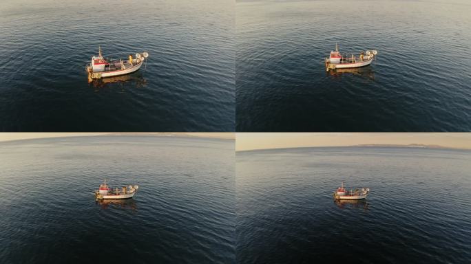 30岁出头的高加索渔民拉着早上的渔获物