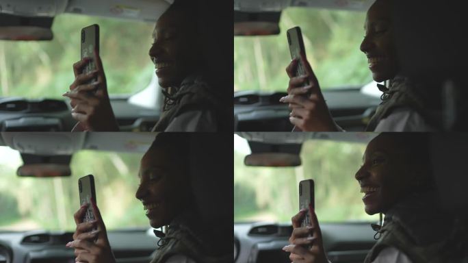 朋友们在公路旅行中使用手机拍摄