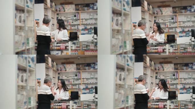 亚洲华人女药剂师在药房柜台向资深男性顾客解释