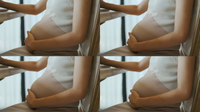 亚洲孕妇摩擦肚子胎教生育产妇