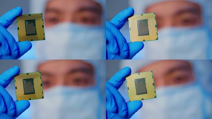 工程师手持微芯片生产制造电脑心脏
