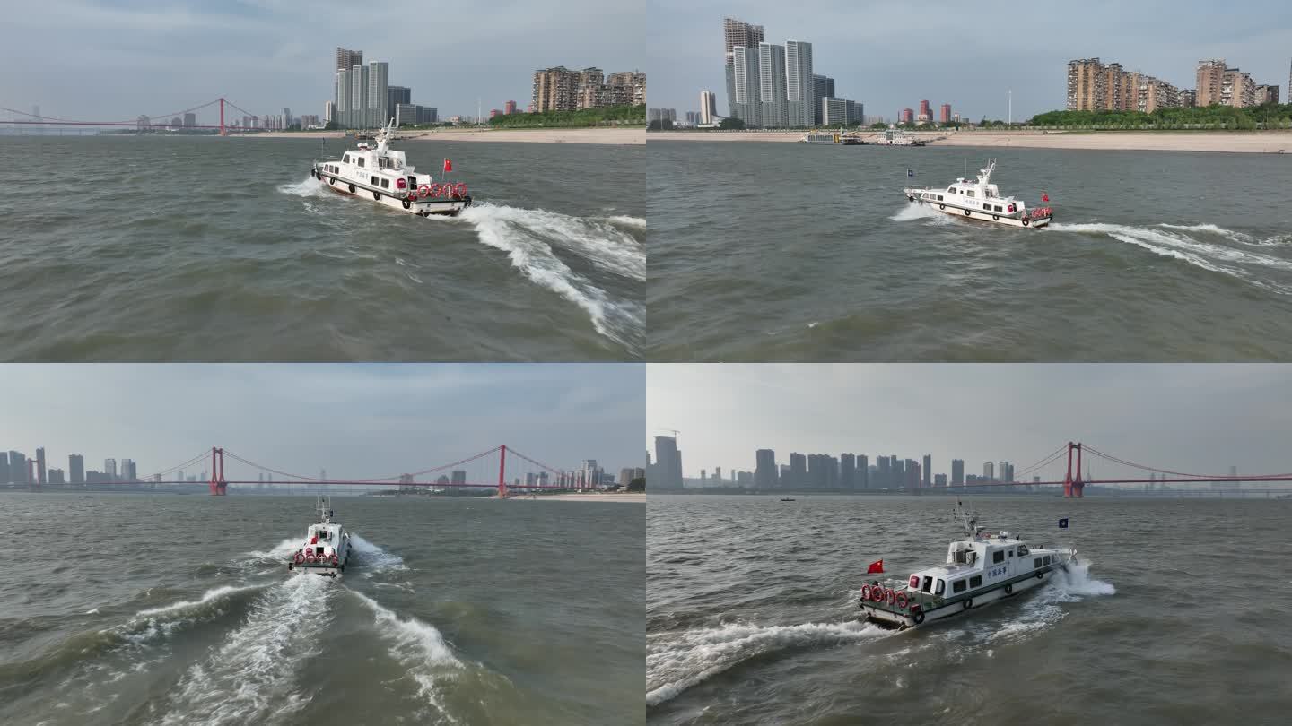 航拍跟拍中国海事快艇驰骋航行在武汉长江上