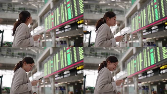 亚洲女商人在看机场登机牌
