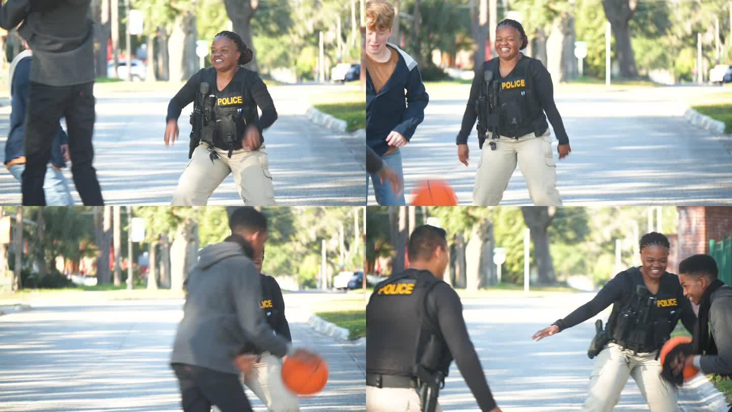 两名警察正在和两名年轻人打篮球