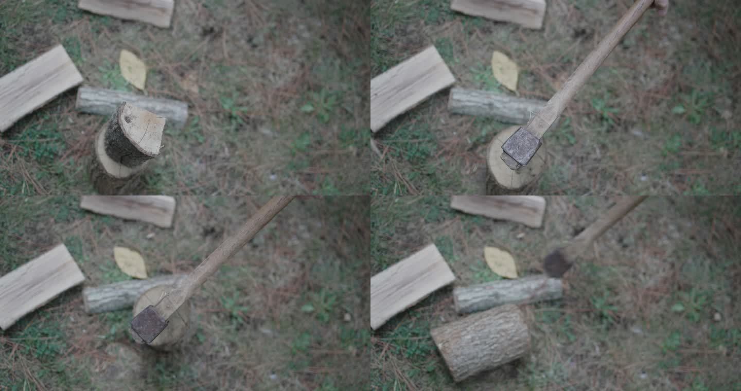 一个戴着安全眼镜的中年人把木柴劈成两半当柴火，一个阴天的黄昏，一个中年人劈柴，