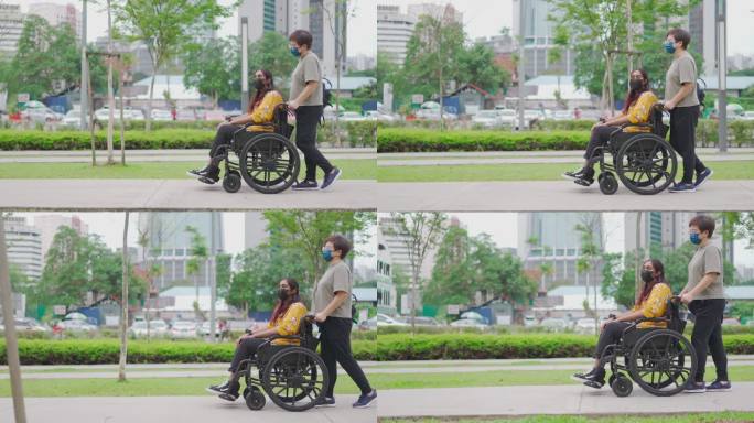 一名亚裔中国中年妇女在城市街道上推着她的印度残疾女性朋友