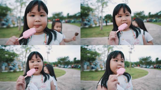 亚洲兄弟姐妹女孩和姐妹快乐地吃冰淇淋。