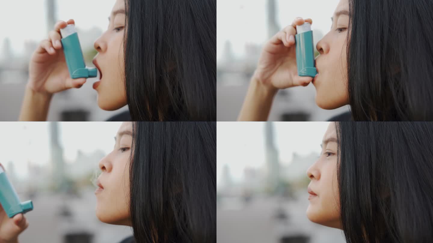 亚洲妇女使用哮喘吸入器