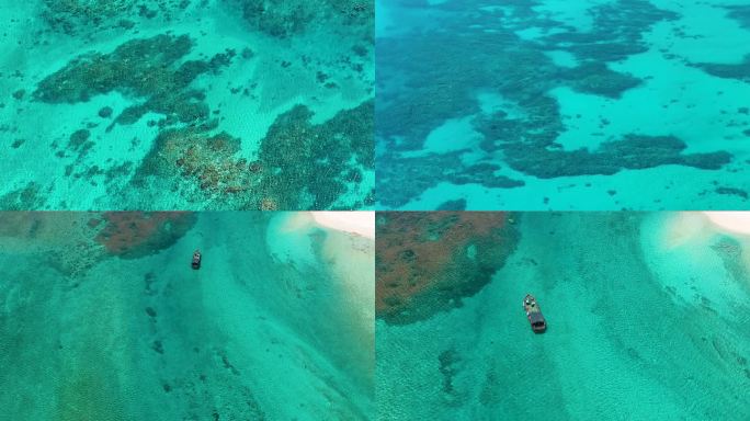 航拍南海蓝色大海海底珊瑚礁漂泊的船
