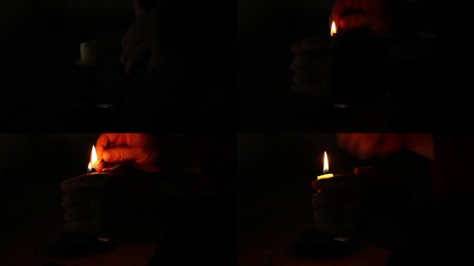 深夜划火柴点燃蜡烛照明