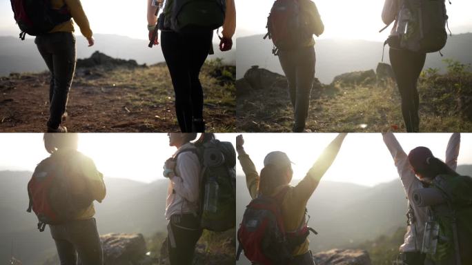 两个带着露营背包的女徒步旅行者徒步走到山顶