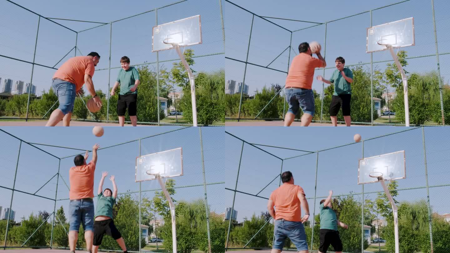 父亲和儿子在室外球场打篮球