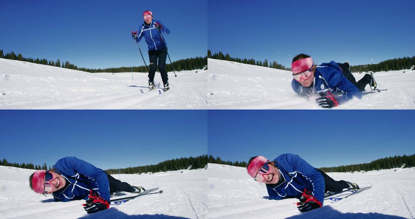 一个20多岁的年轻女子越野滑雪的慢镜头，她摔倒在雪地上，看着相机笑着