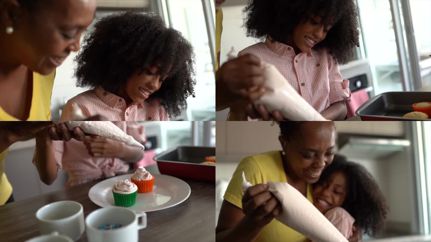 母亲和女儿在家一起装饰纸杯蛋糕