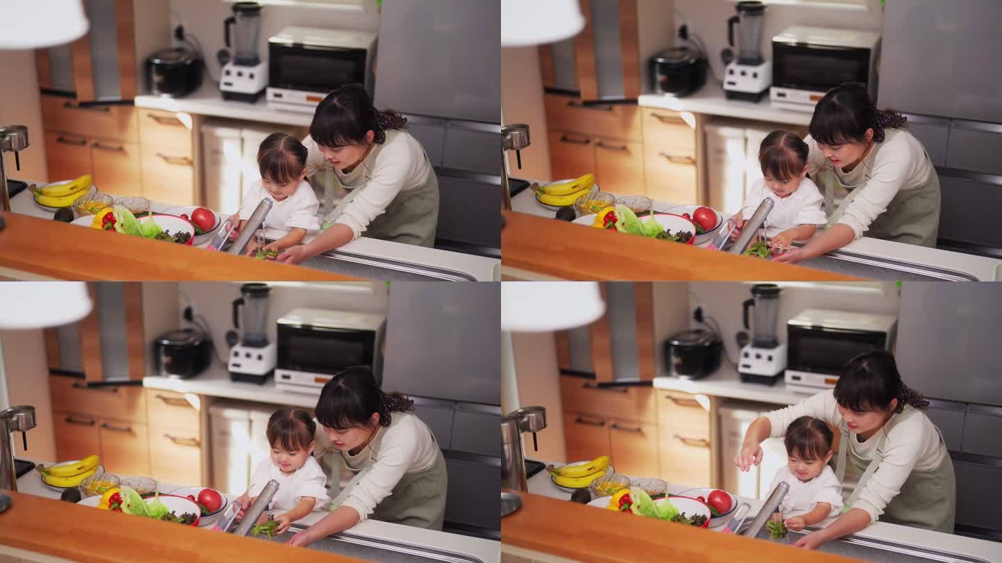 母亲帮助她的小女儿洗蔬菜，鼓励她健康饮食