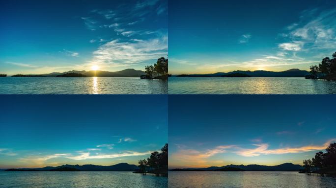 日落时山和湖的宁静场景，从白天到黄昏的延时视频