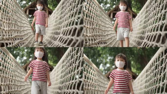 在网绳上平衡小女孩疫情期间戴口罩一个人